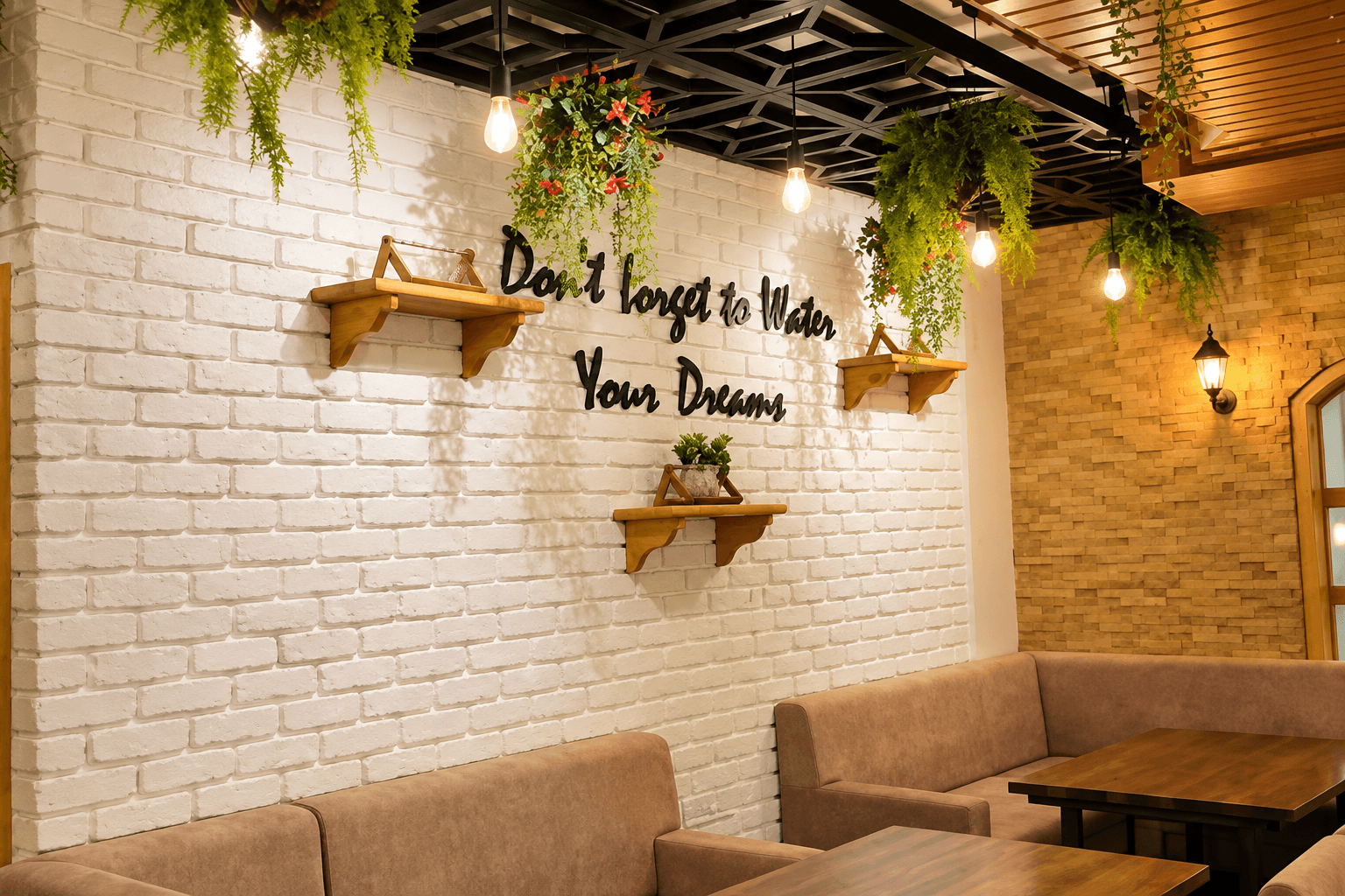 White brick wall with trailing vines, a lettered sign and cushioned banquette seating at The Plant Story